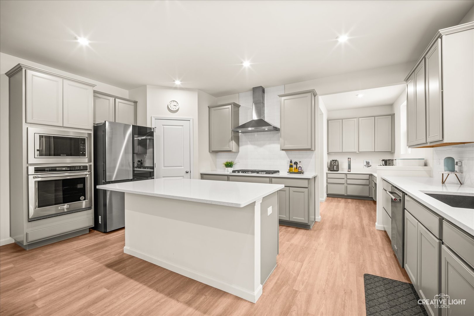 3667 Peregrine Way Elgin, IL 60124 - Photo 11 of 35 a kitchen with stainless steel appliances sink stove refrigerator and cabinets