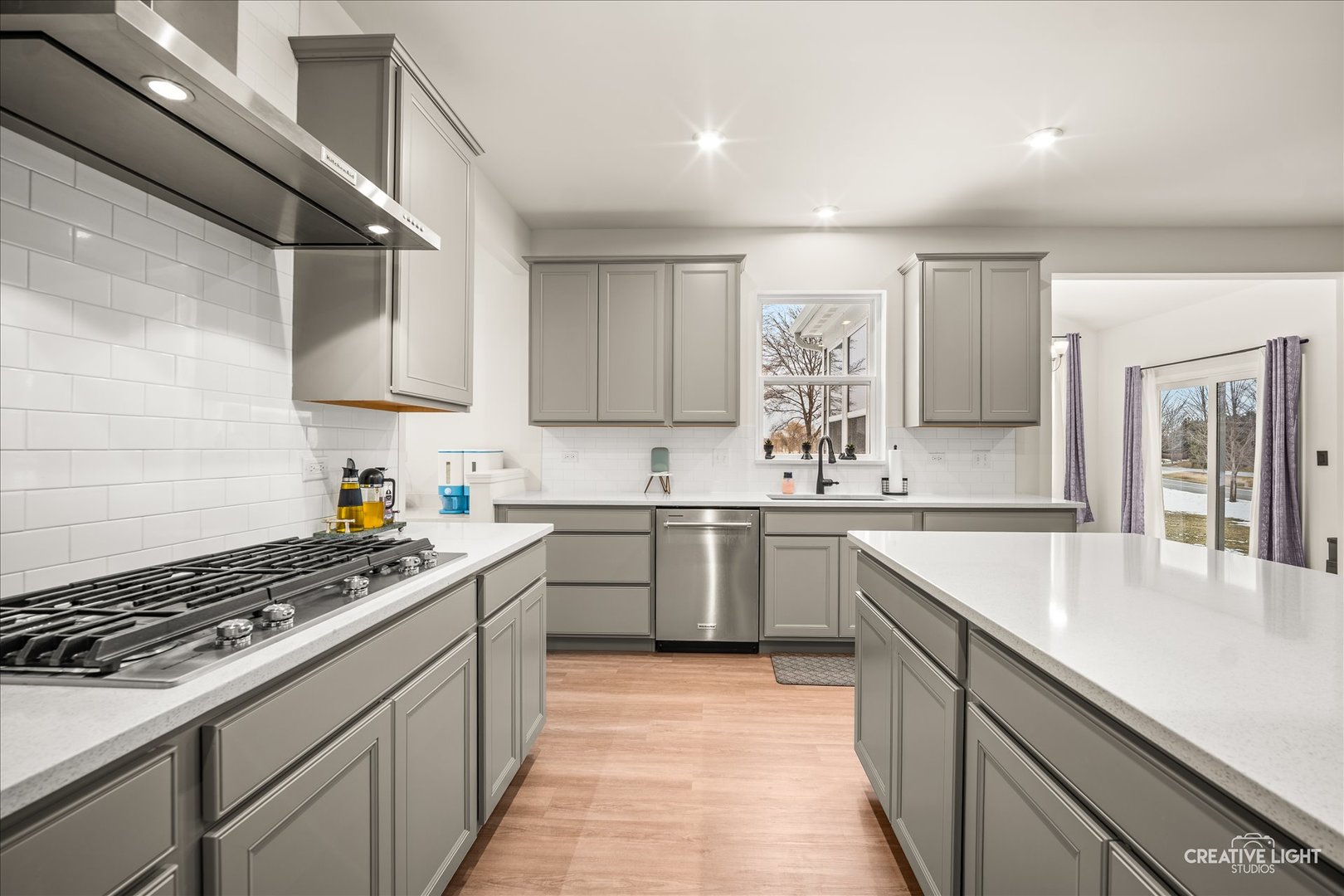 3667 Peregrine Way Elgin, IL 60124 - Photo 13 of 35 a kitchen with a sink stove and cabinets