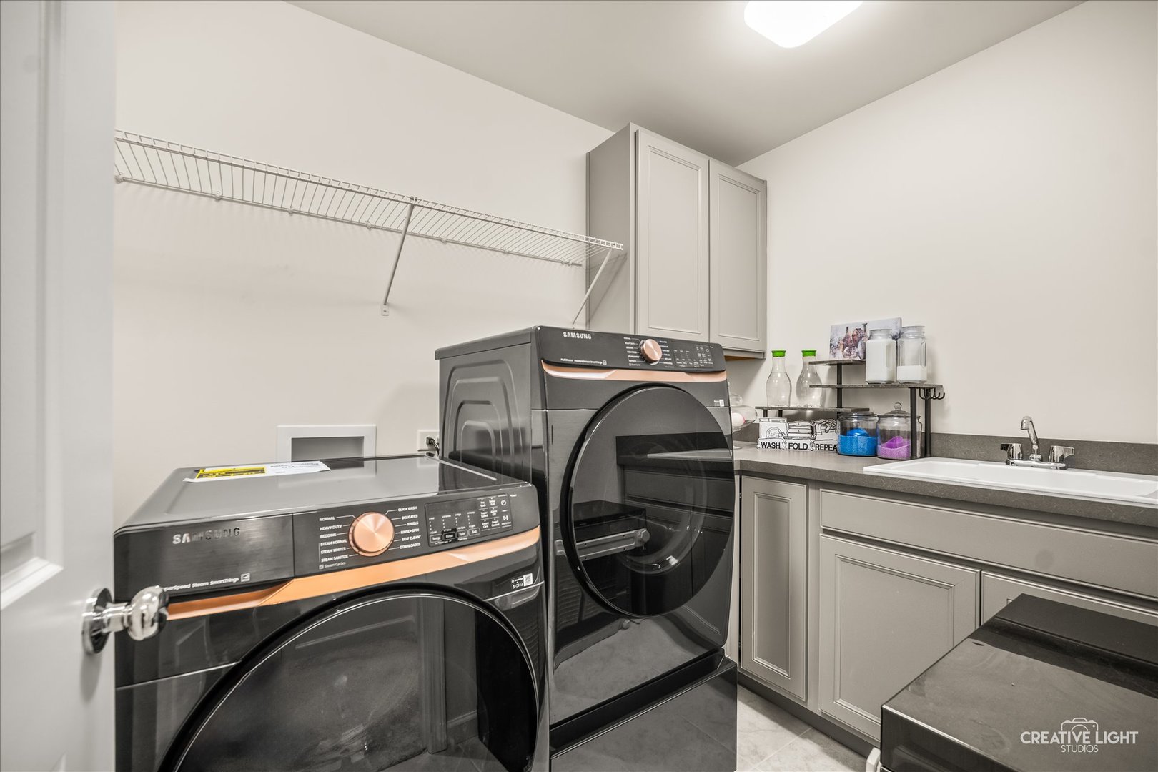 3667 Peregrine Way Elgin, IL 60124 - Photo 24 of 35 a storage utility room with a sink and cabinets