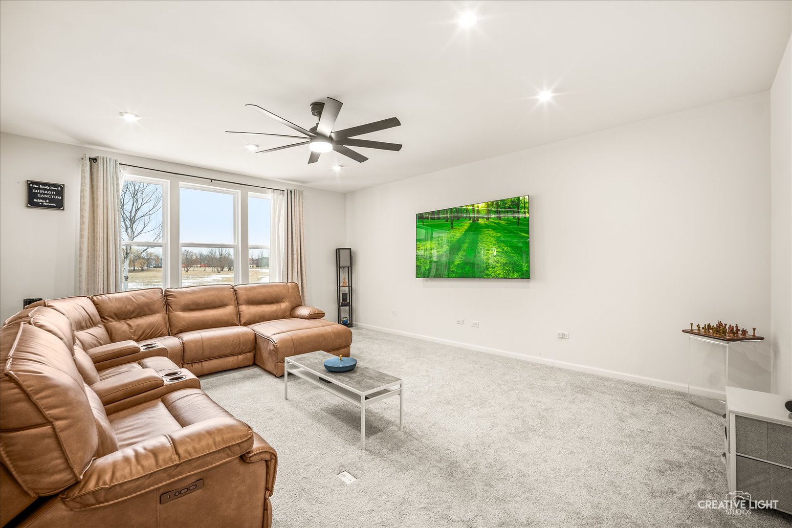 3667 Peregrine Way Elgin, IL 60124 - Photo 7 of 35 a living room with furniture and a flat screen tv