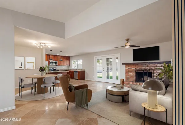 a living room with furniture a fireplace and a flat screen tv