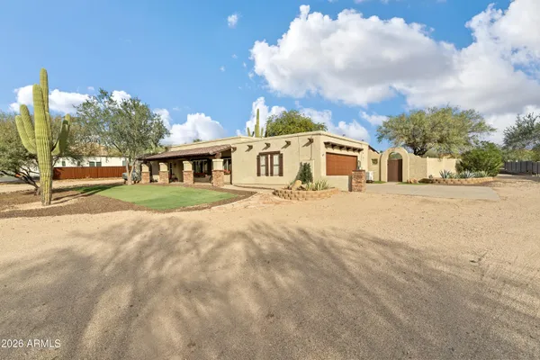 a large kitchen with granite countertop a large counter top stainless steel appliances and cabinets