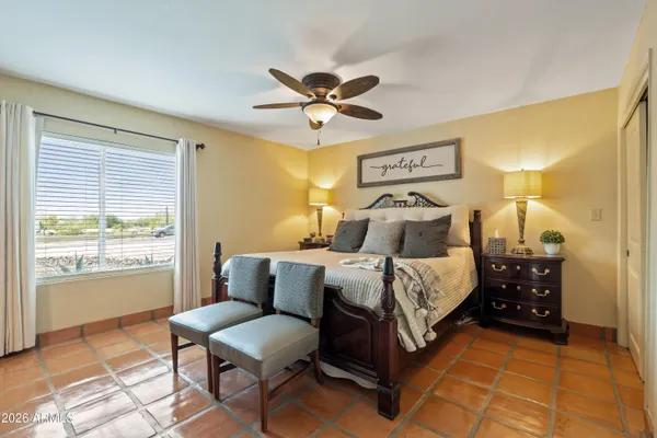 a view of a swimming pool with lawn chairs