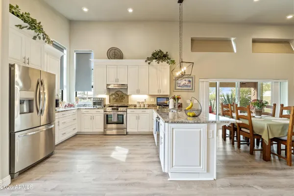 a living room with furniture a mirror and a fireplace