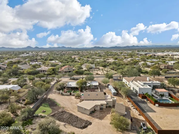 a living room with furniture a wooden floor and a sink