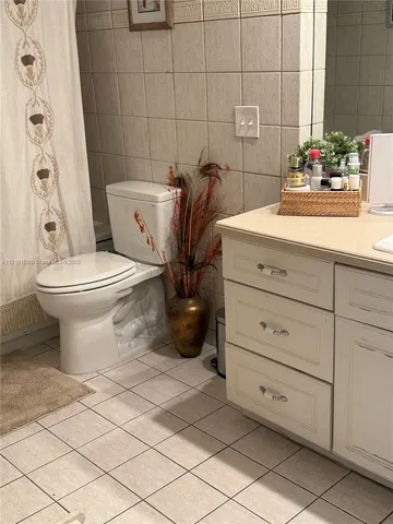 a bathroom with a toilet and a sink