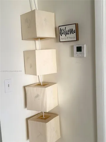 a view of balcony with two chairs and wooden floor