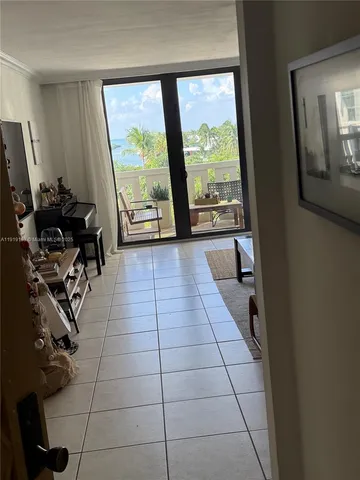 a view of a room with gym equipment and a large window