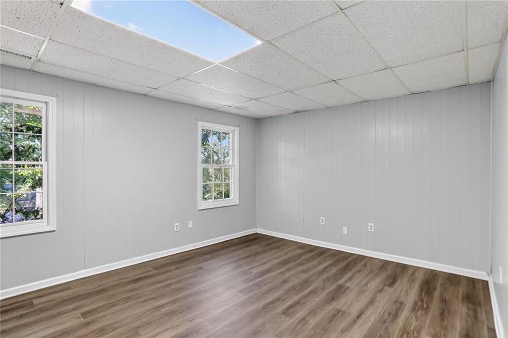 2817 Thornridge Drive Atlanta, GA 30340 - Photo 13 of 15 an empty room with wooden floor and windows