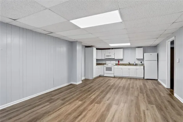 a view of kitchen with wooden floor