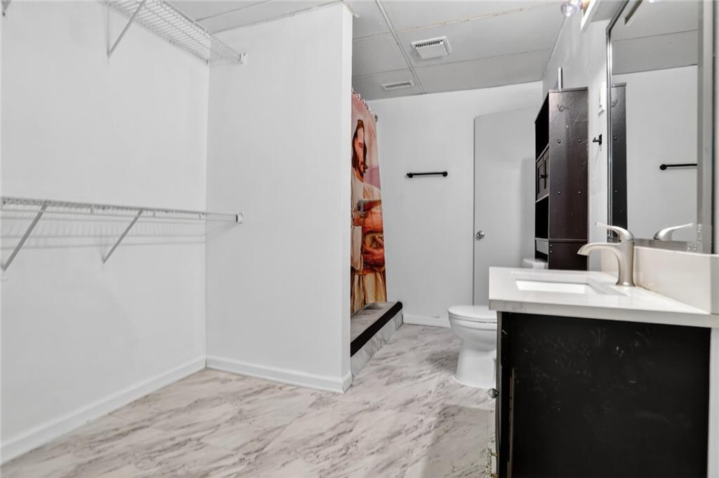2817 Thornridge Drive Atlanta, GA 30340 - Photo 6 of 15 a bathroom with a sink and a mirror