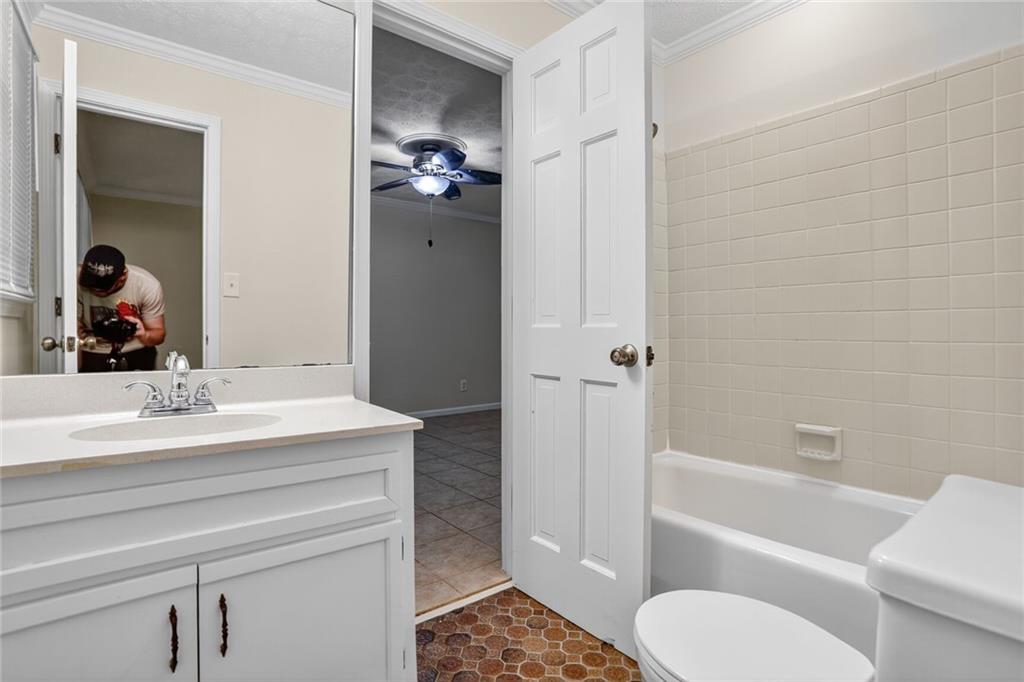 2817 Thornridge Drive Atlanta, GA 30340 - Photo 7 of 15 a bathroom with a sink a toilet and a bathtub