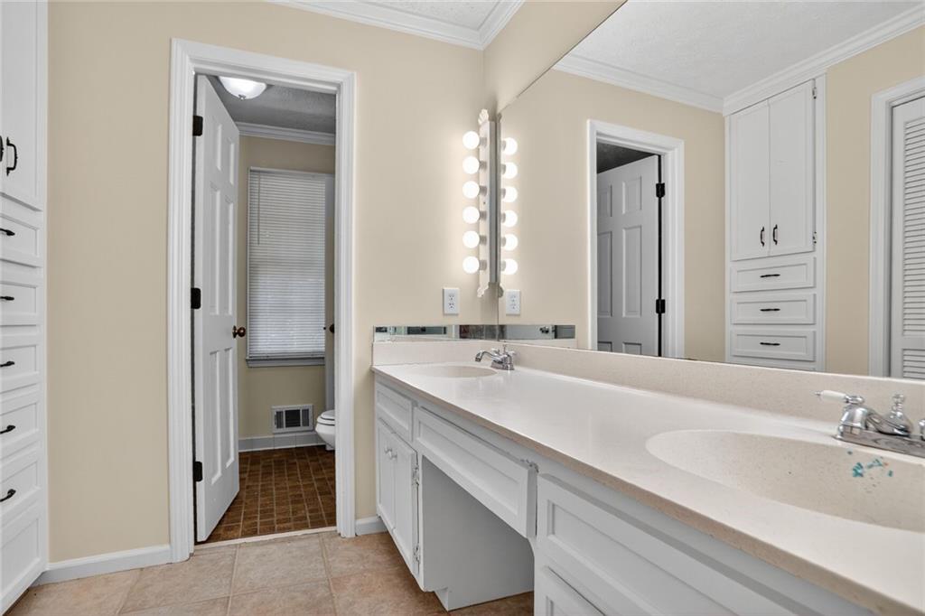 2817 Thornridge Drive Atlanta, GA 30340 - Photo 10 of 15 a spacious bathroom with a double vanity sink mirror and double