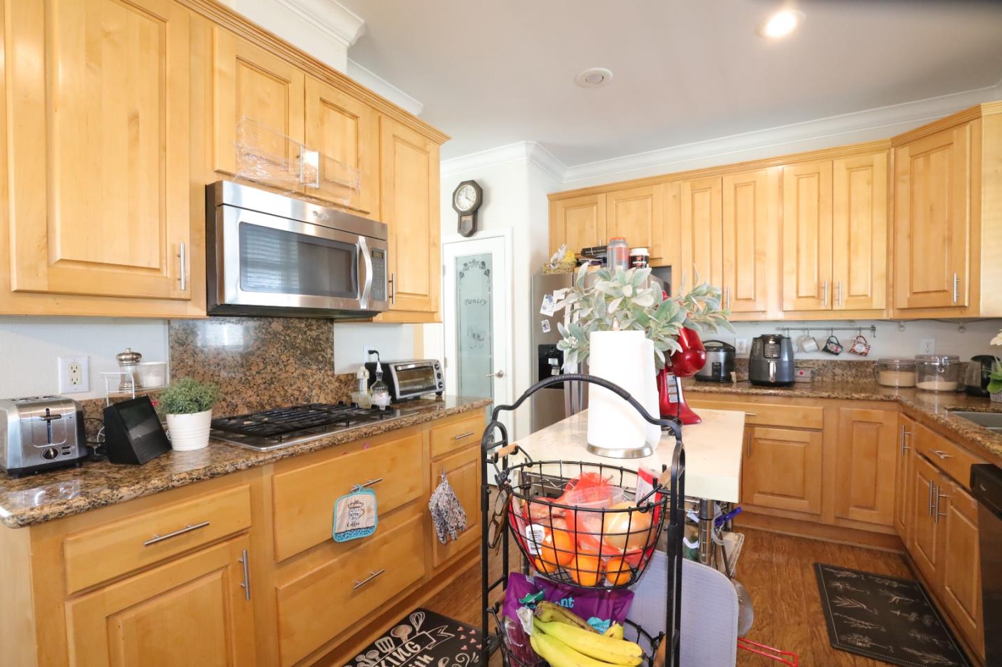 5450 Monterey Road, Unit 182 San Jose, CA 95111 - Photo 19 of 33 a kitchen with stainless steel appliances granite countertop a stove a sink and a microwave