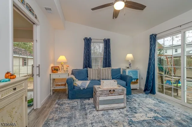 a living room with furniture and a window