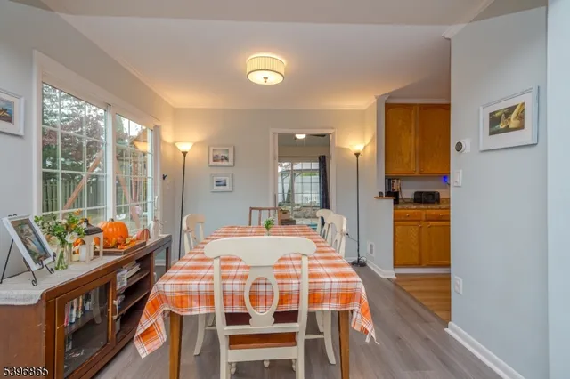 a dining room with furniture and a window