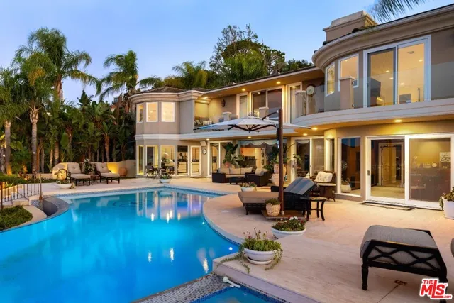 a view of a chairs and table in the patio