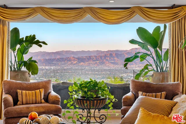a kitchen with lots of counter top space and stainless steel appliances