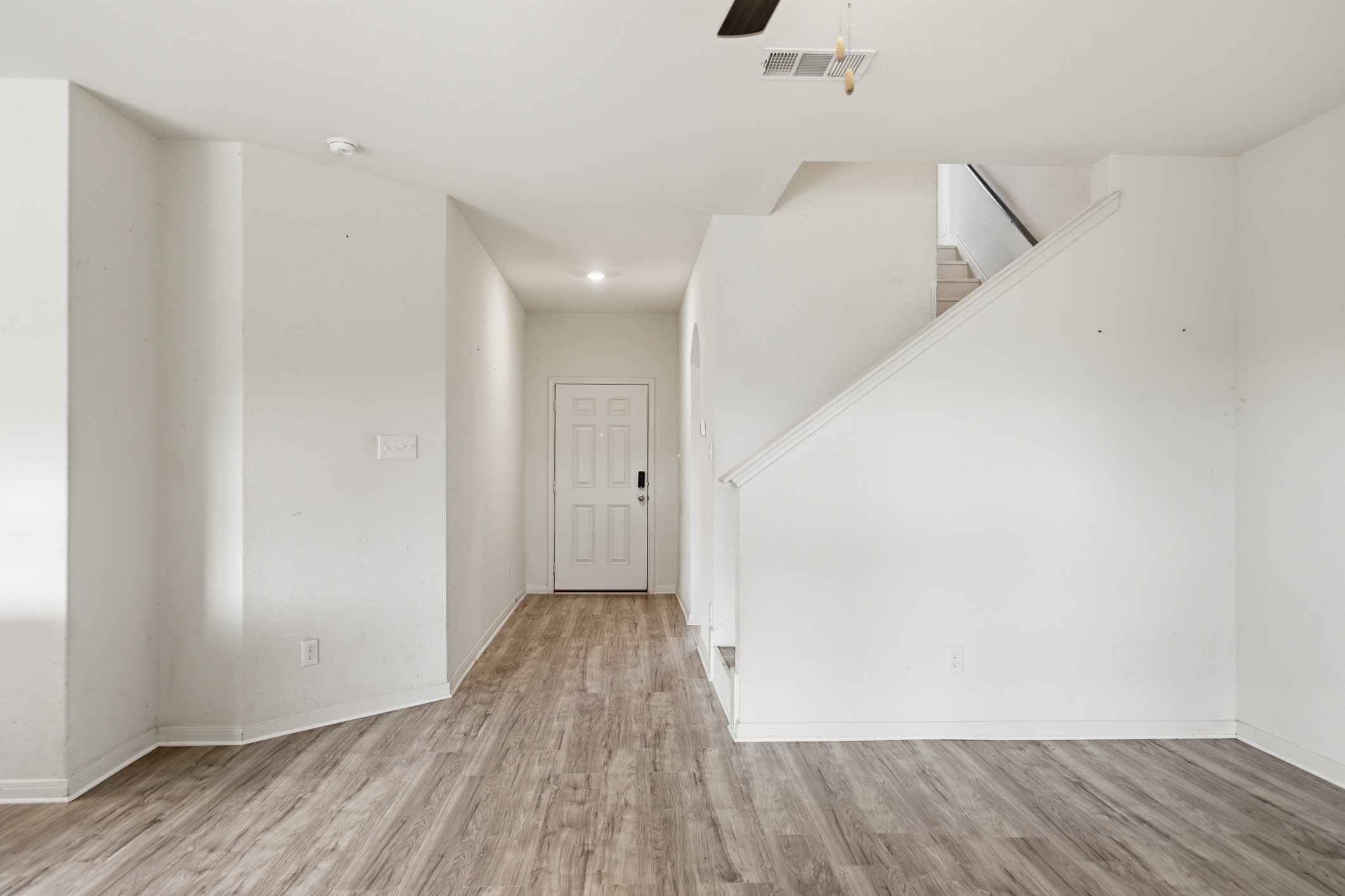 300 Hyacinth Way Jarrell, TX 76537 - Photo 5 of 37 a view of hallway with wooden floor
