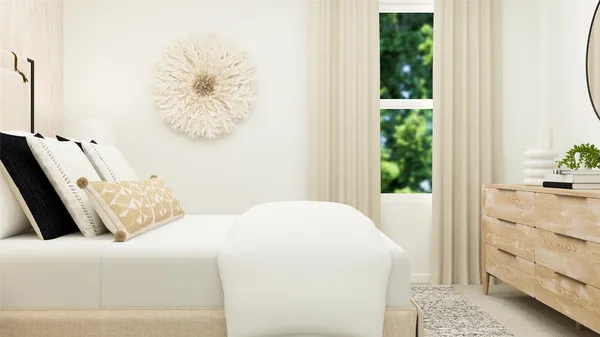 a bedroom with a bed and a potted plant