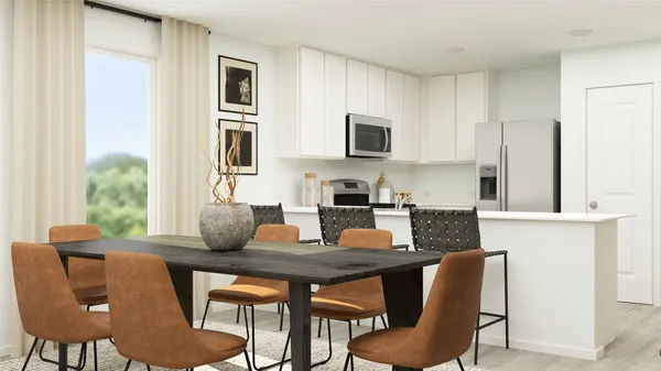 a kitchen with stainless steel appliances kitchen island granite countertop a table and chairs