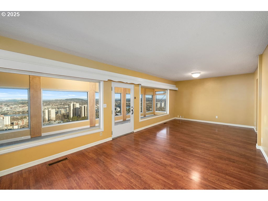 2604 Southwest Buckingham Avenue Portland, OR 97201 - Photo 13 of 32 a view of an empty room with a window