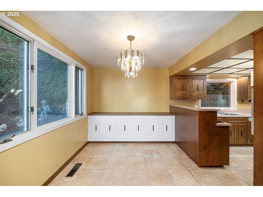 2604 Southwest Buckingham Avenue Portland, OR 97201 - Photo 22 of 32 a view of kitchen with granite countertop cabinets