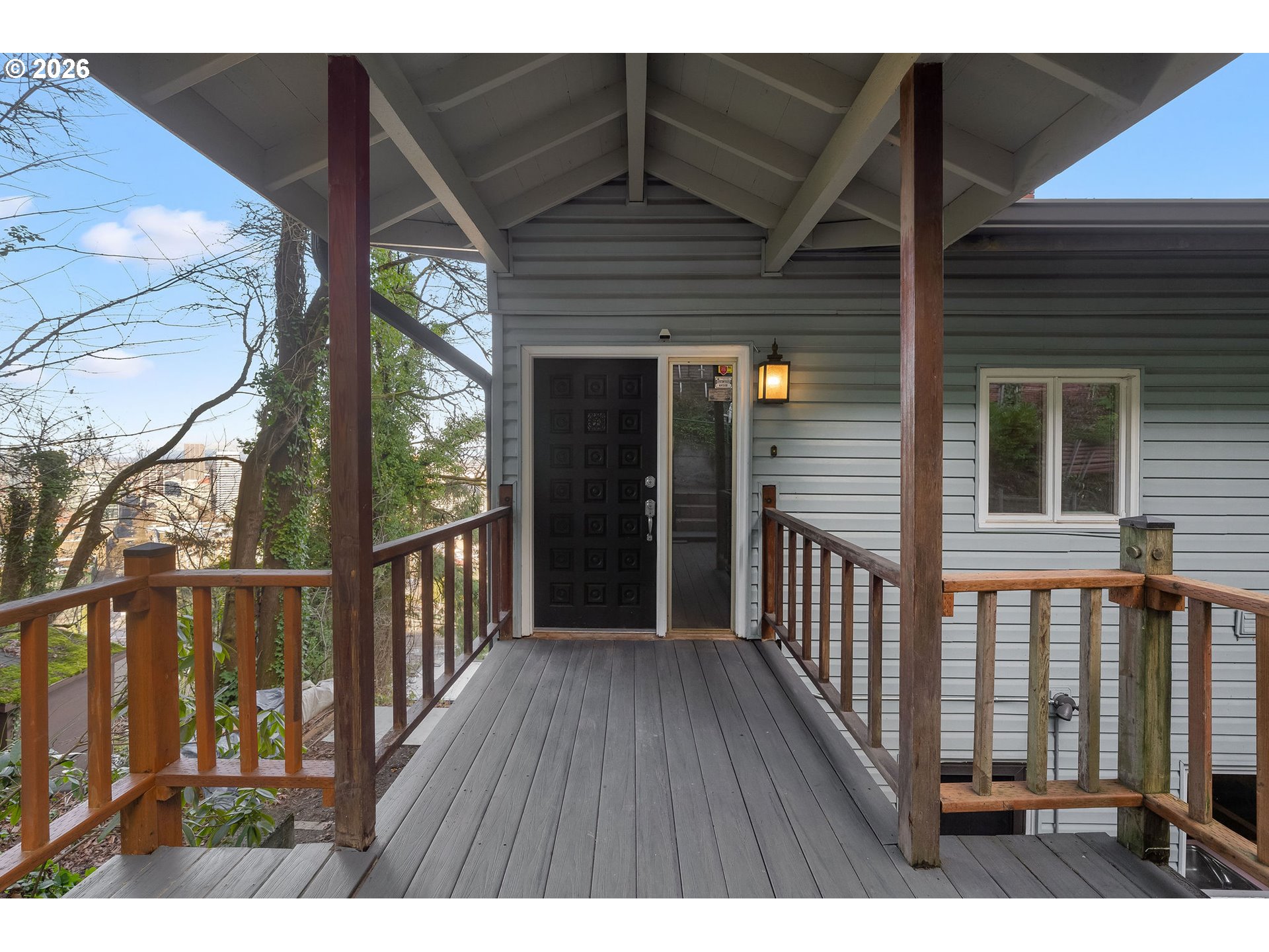 2604 Southwest Buckingham Avenue Portland, OR 97201 - Photo 4 of 32 a view of a house with wooden deck