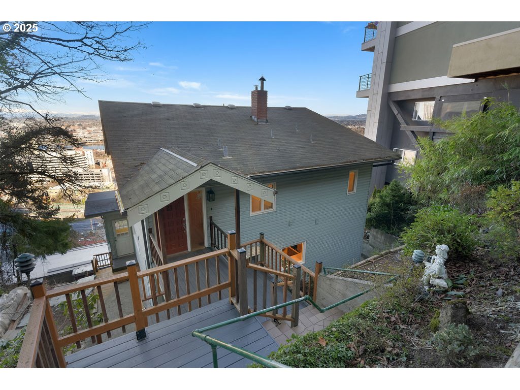 2604 Southwest Buckingham Avenue Portland, OR 97201 - Photo 5 of 32 a view of a house with a window