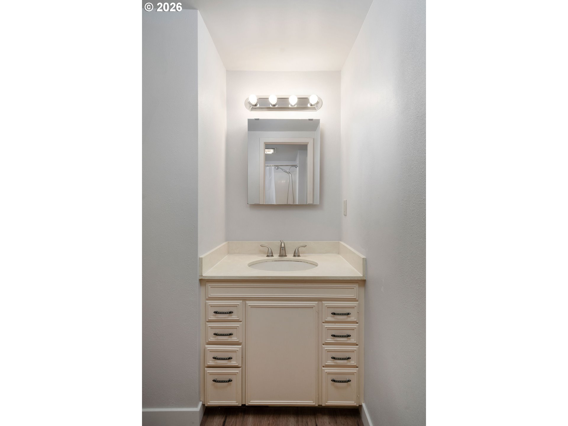 2604 Southwest Buckingham Avenue Portland, OR 97201 - Photo 9 of 32 a bathroom with a sink and a mirror
