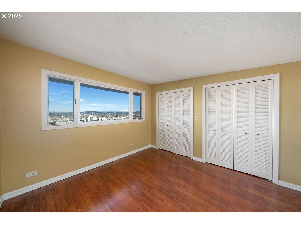 2604 Southwest Buckingham Avenue Portland, OR 97201 - Photo 10 of 32 a view of empty room with wooden floor