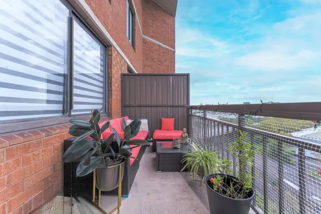 a view of a chairs and table in the balcony