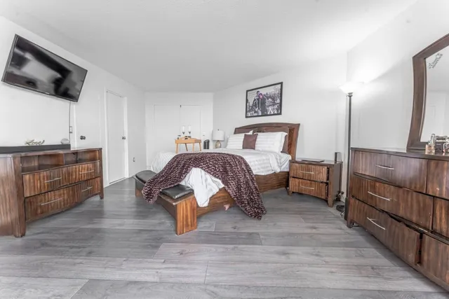 a living room with a bed and furniture