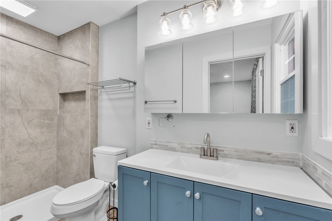 2038 Avant Circle Anderson, SC 29625 - Photo 22 of 32 This bathroom features a contemporary vanity with a sleek countertop, complemented by a tiled shower.