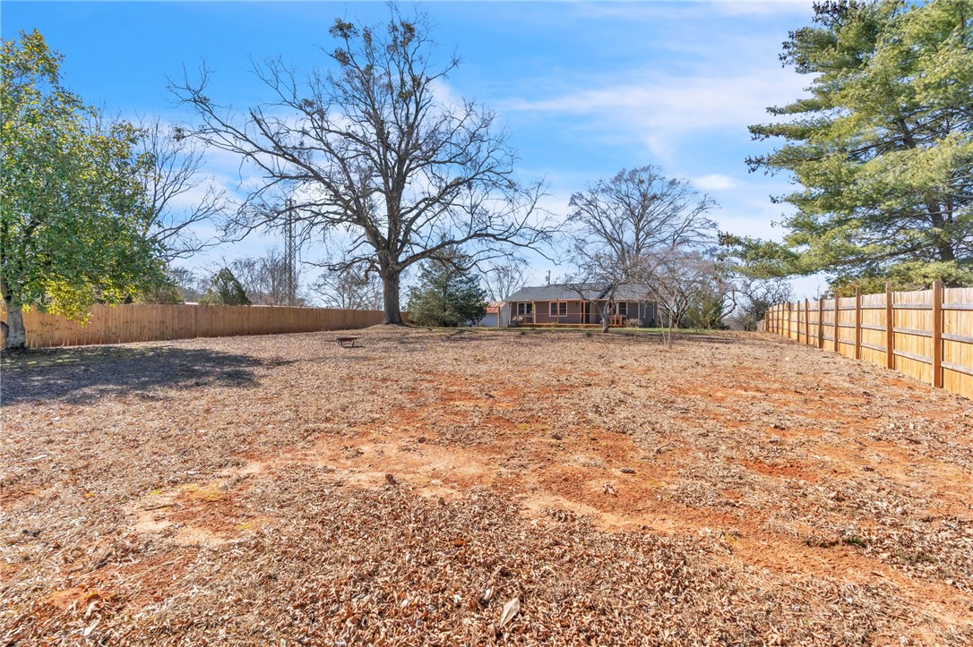 2038 Avant Circle Anderson, SC 29625 - Photo 25 of 32 This spacious yard offers ample outdoor potential, surrounded by mature trees and a privacy fence.