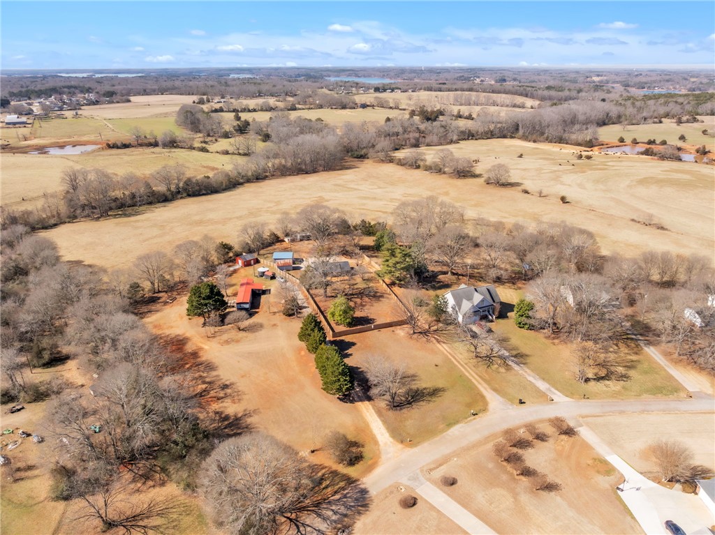 2038 Avant Circle Anderson, SC 29625 - Photo 26 of 32 This sprawling estate offers expansive grounds with various outbuildings amidst a rural landscape.