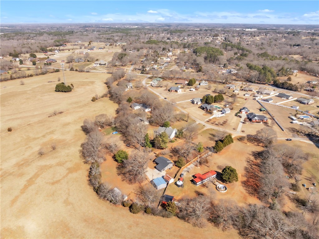 2038 Avant Circle Anderson, SC 29625 - Photo 30 of 32 Expansive aerial view showcasing rural homes nestled amidst vast open fields.