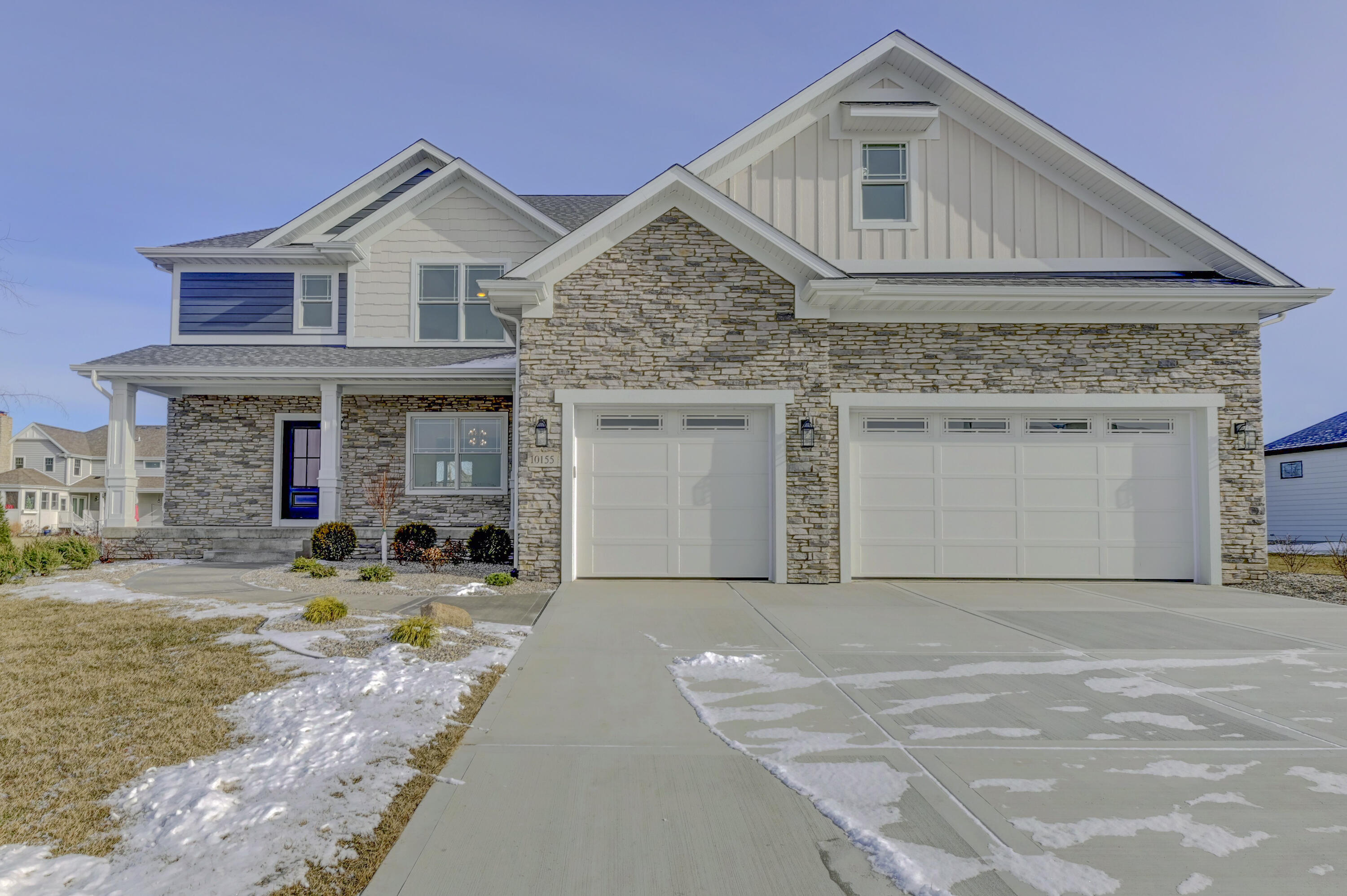 a front view of a house with yard and seating area