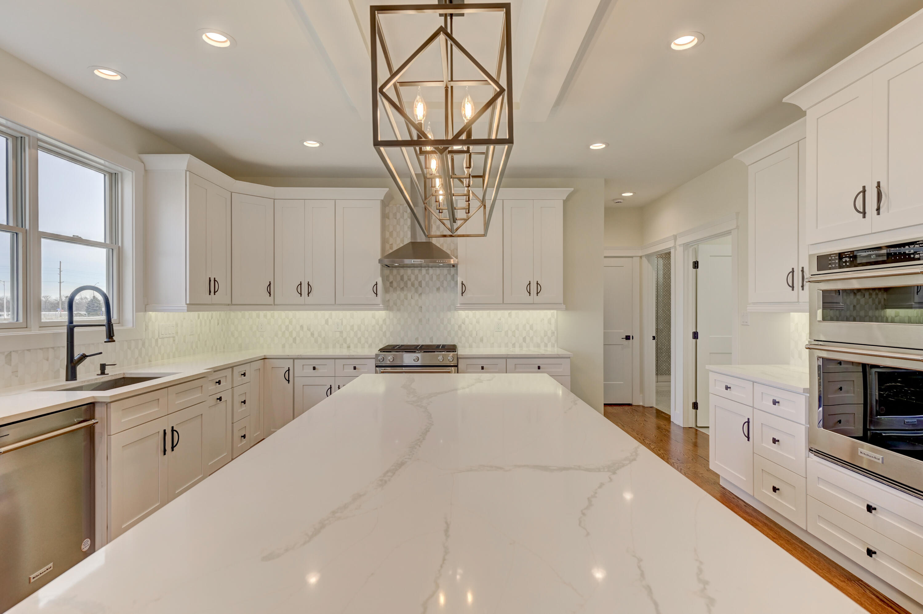 10155 Barbara Lane Munster, IN 46321 - Photo 13 of 36 a large kitchen with stainless steel appliances kitchen island granite countertop a sink and cabinets