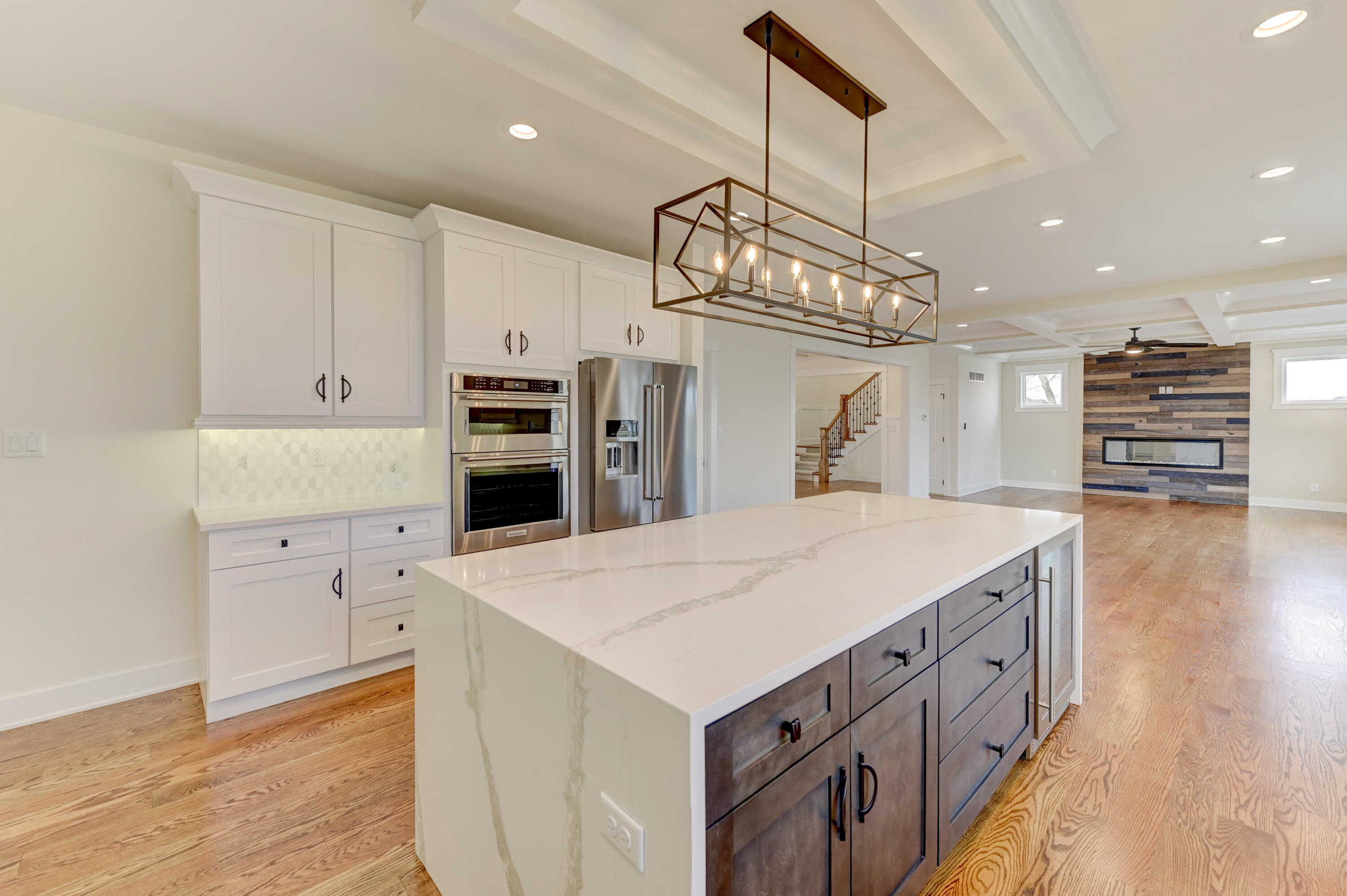 10155 Barbara Lane Munster, IN 46321 - Photo 14 of 36 a kitchen that has a lot of cabinets in it and wooden floors