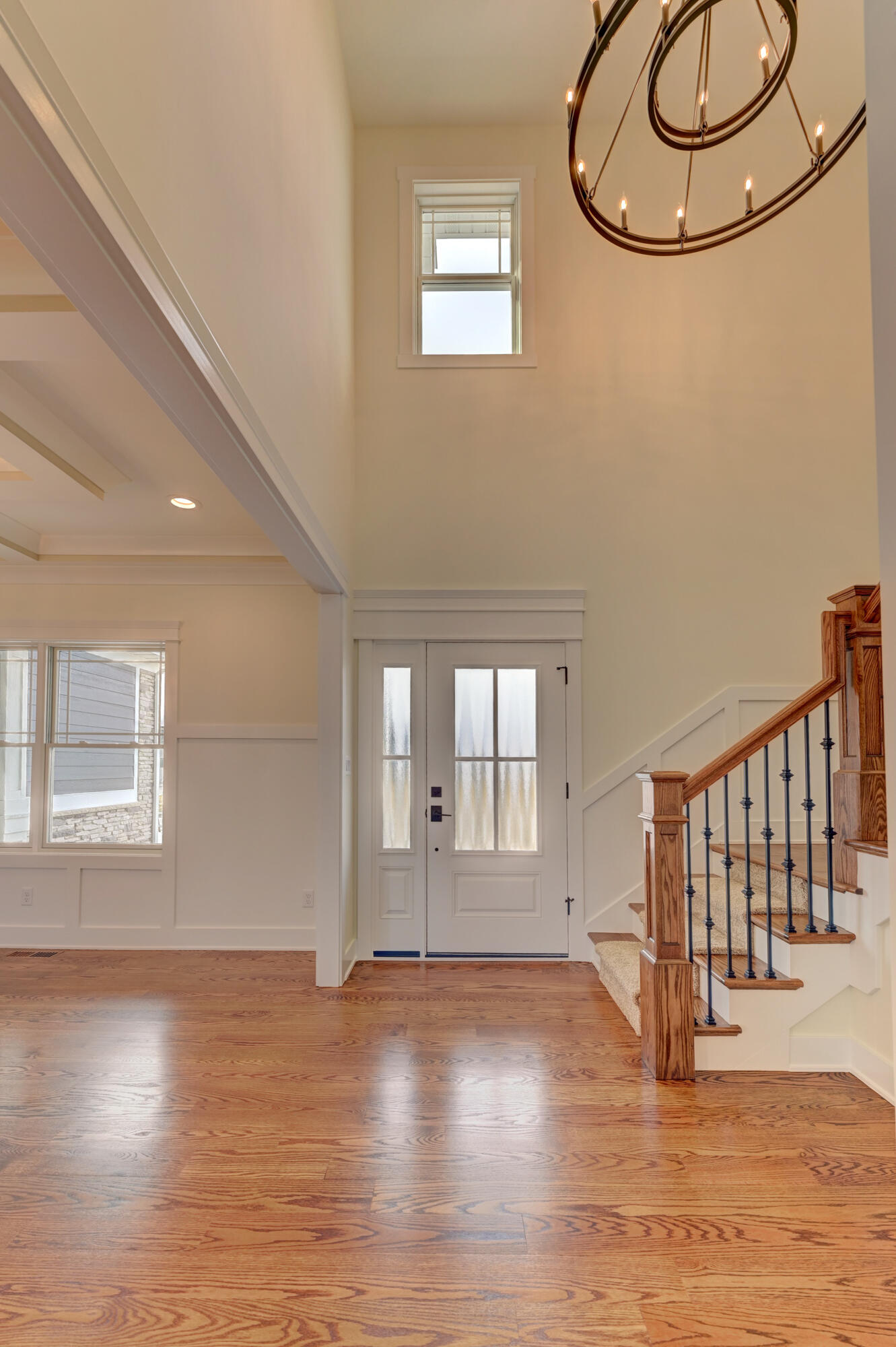 10155 Barbara Lane Munster, IN 46321 - Photo 3 of 36 a view of an empty room with wooden floor and a window