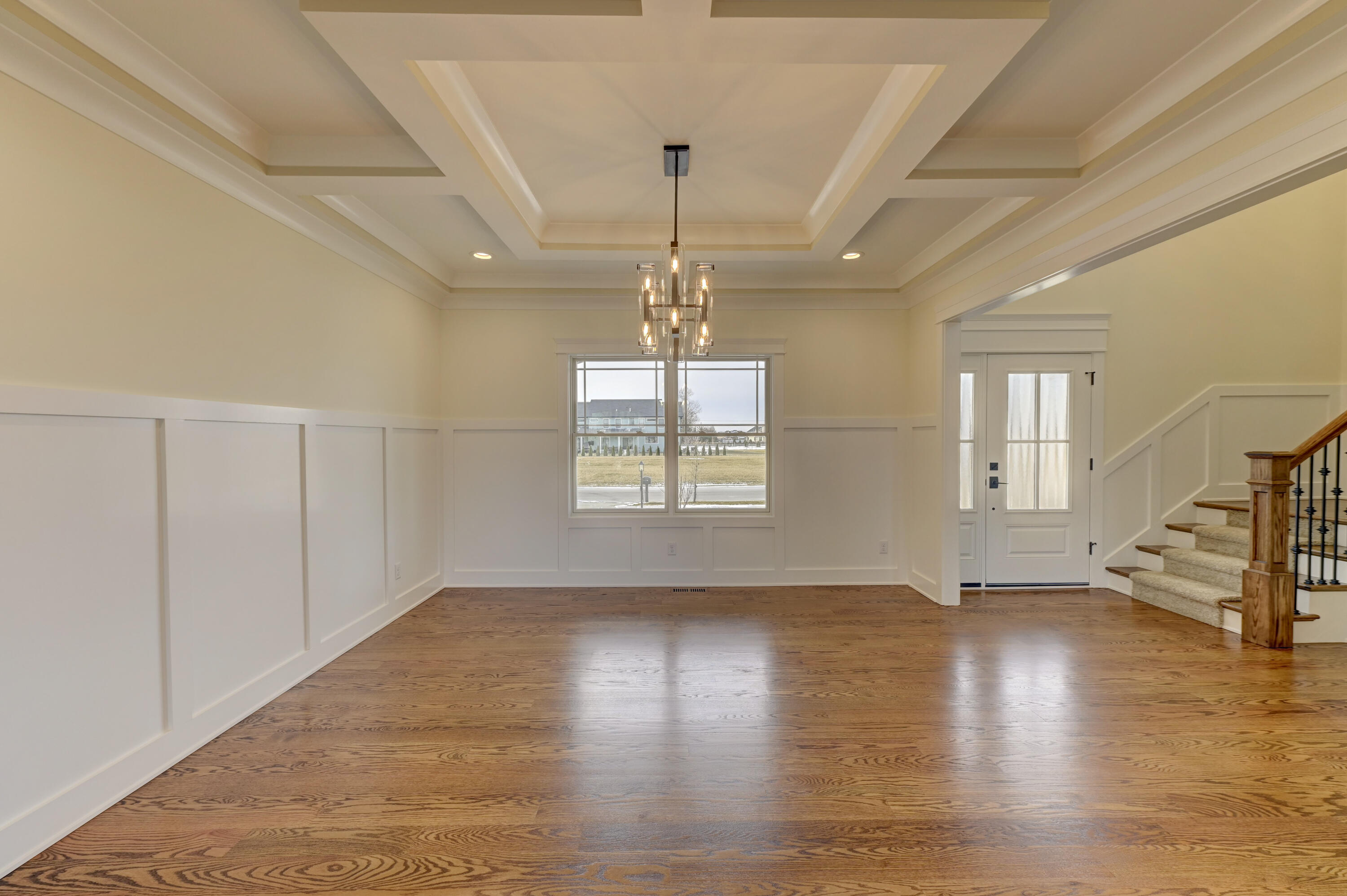 10155 Barbara Lane Munster, IN 46321 - Photo 4 of 36 a view of an empty room with wooden floor and a window