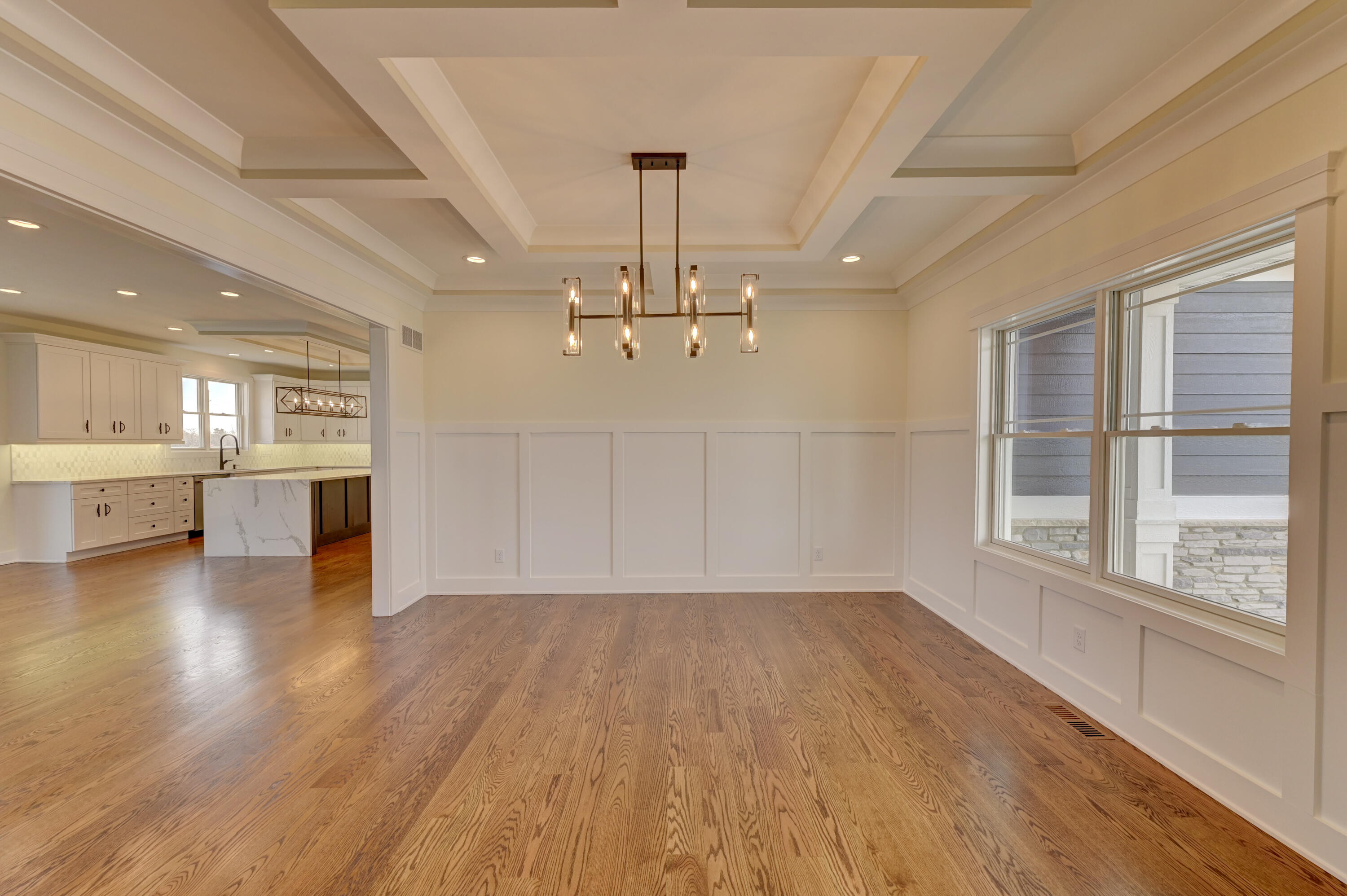 10155 Barbara Lane Munster, IN 46321 - Photo 5 of 36 wooden floor in an empty room with a kitchen