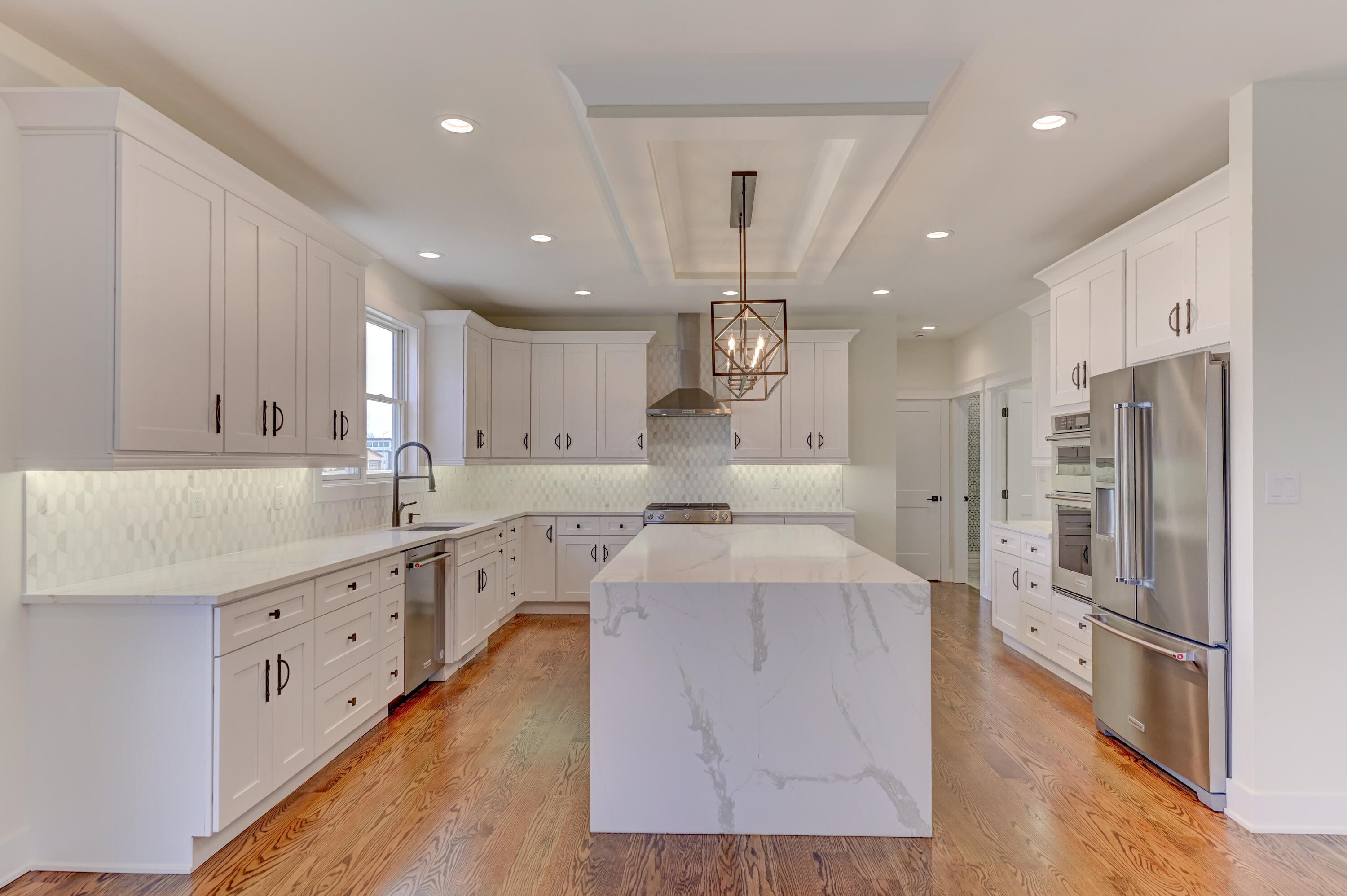 10155 Barbara Lane Munster, IN 46321 - Photo 9 of 36 a large kitchen with stainless steel appliances kitchen island granite countertop a large counter top a sink stainless steel appliances and cabinets