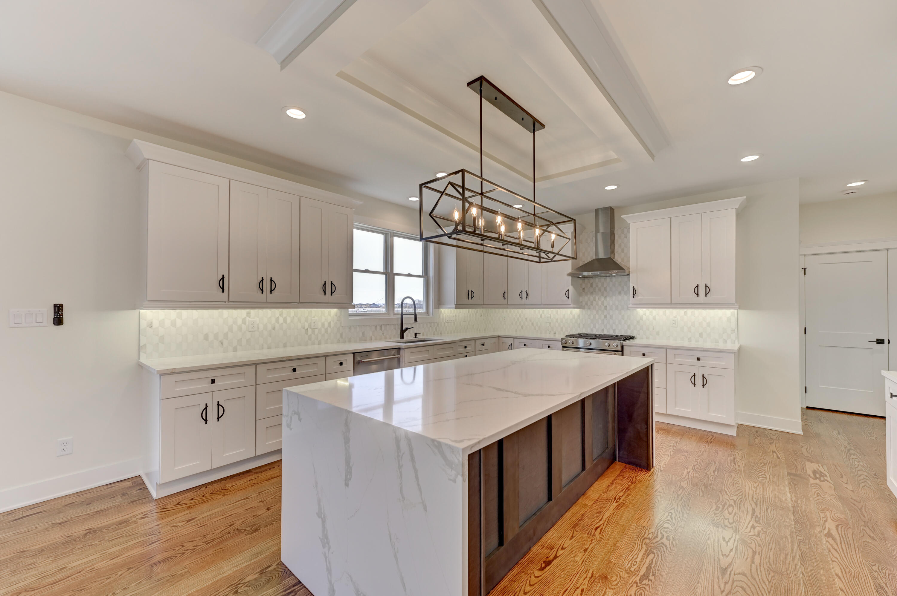 10155 Barbara Lane Munster, IN 46321 - Photo 10 of 36 a kitchen with a sink stove and cabinets