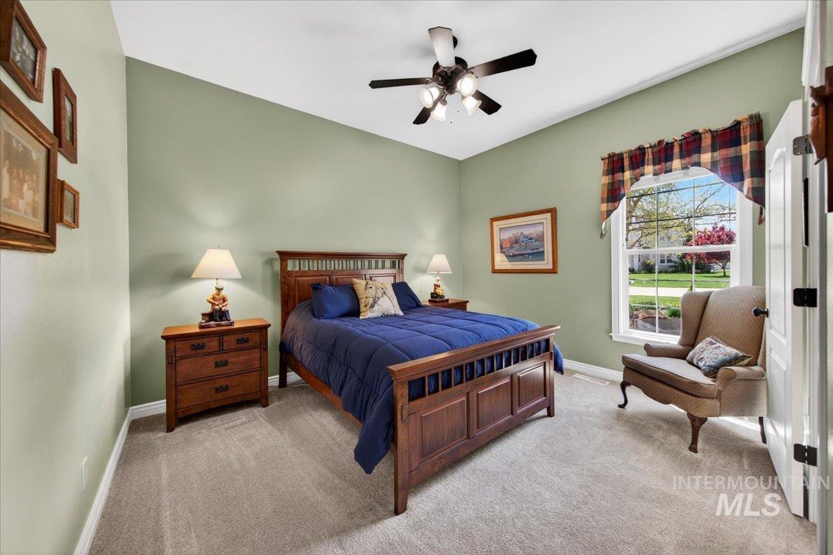 414 East Shafer View Drive Meridian, ID 83642 - Photo 31 of 50 Bedroom #4 13x12 featuring a 10' ceiling with a ceiling fan, a sunny window, Plush carpet, adjoining full jack & Jill Bathroom, walk-in closet