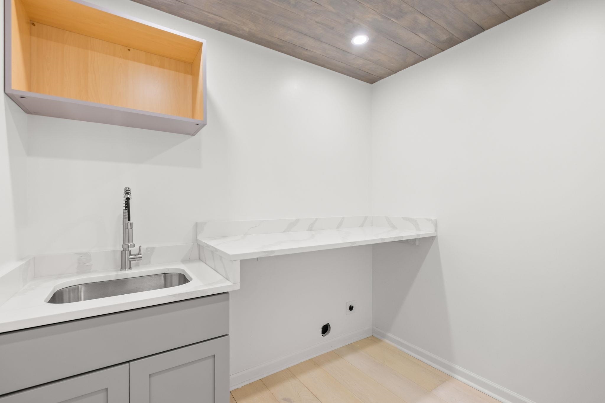 6224 Benjestown Road Memphis, TN 38127 - Photo 16 of 38 Laundry room featuring wood ceiling, light wood-type flooring, recessed lighting, hookup for an electric dryer, and cabinet space