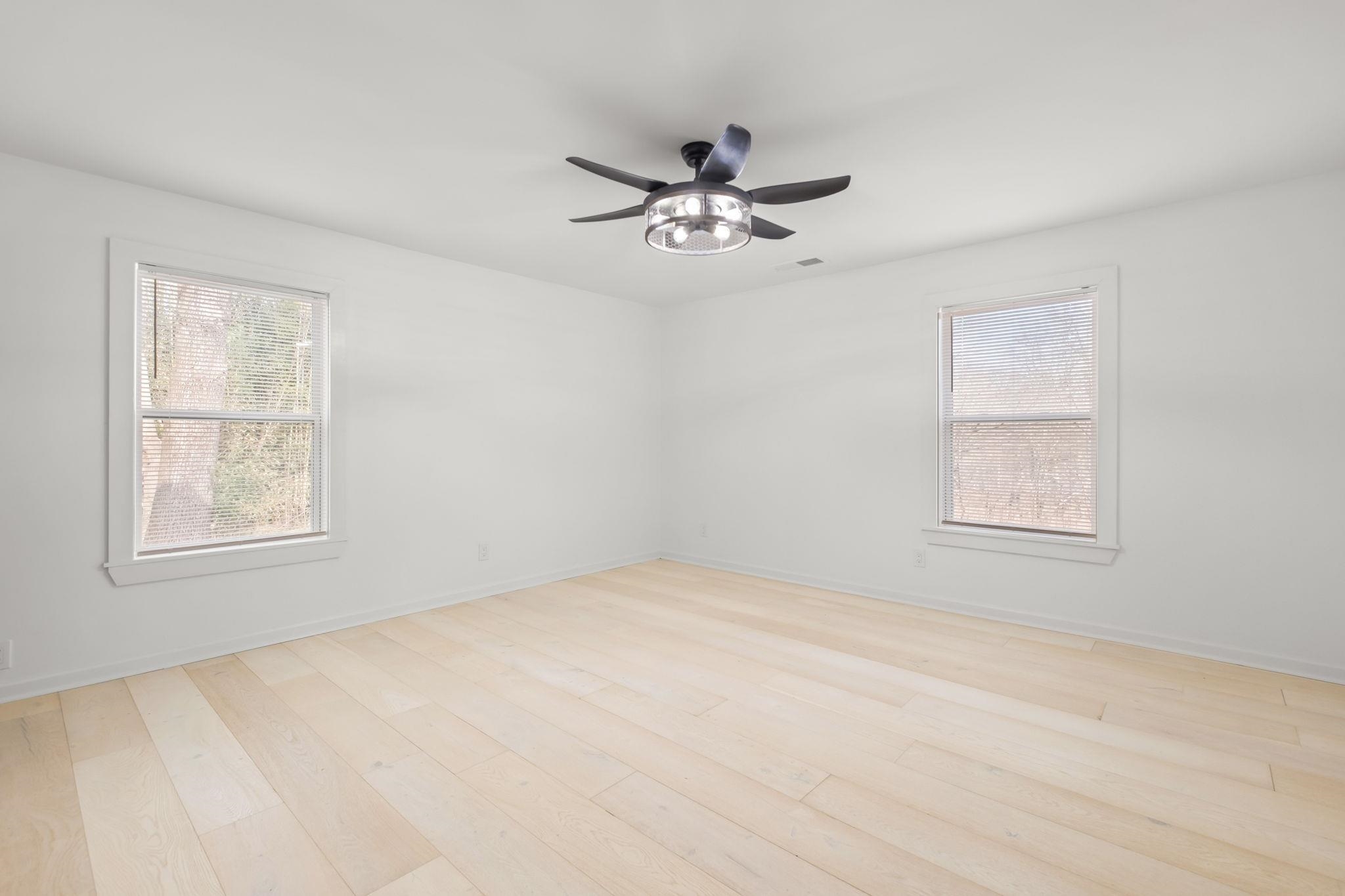 6224 Benjestown Road Memphis, TN 38127 - Photo 24 of 38 Spare room featuring ceiling fan, light wood-type flooring, and plenty of natural light