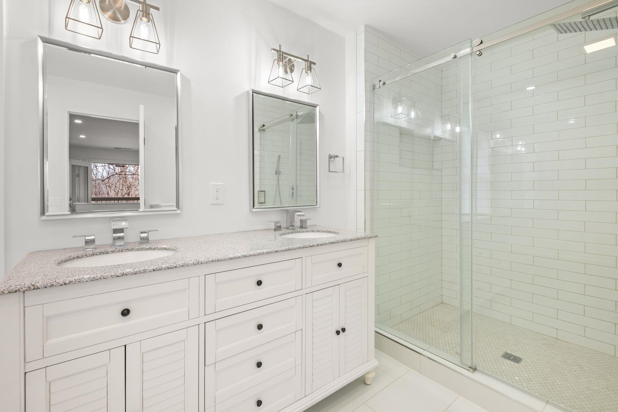 6224 Benjestown Road Memphis, TN 38127 - Photo 32 of 38 Bathroom with double vanity, a shower stall, and light tile patterned flooring