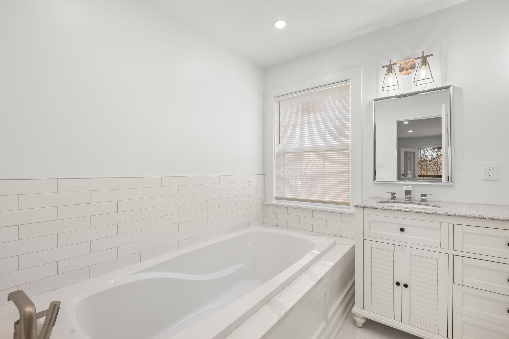 6224 Benjestown Road Memphis, TN 38127 - Photo 33 of 38 Bathroom with vanity, a garden tub, and recessed lighting